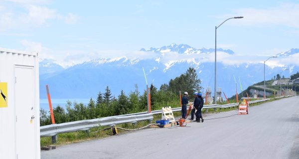 Kinegge employees working outside with the Kinegge mobile office.