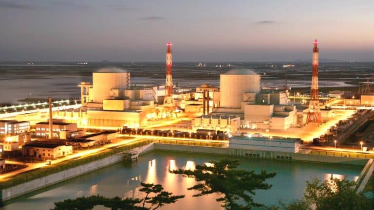 Aerial view of illuminated nuclear plant at sunrise